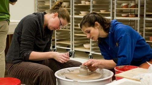 Pottery teacher and student